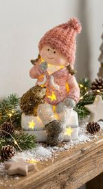 Figure MagicHome Christmas, Girl sitting on a stool with a hedgehog, 1 LED, polyresin, 10.5x10.5x19.