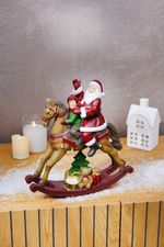 Decoration MagicHome Christmas, Santa with boy on horseback, polyresin, 28x10x30 cm